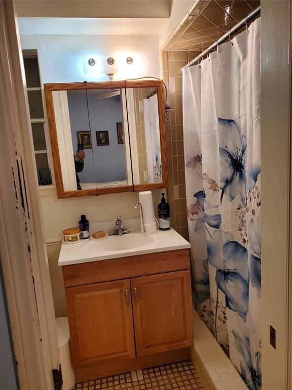 bathroom featuring vanity and walk in shower