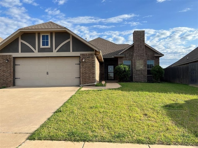 view of front of property featuring a garage and a front yard