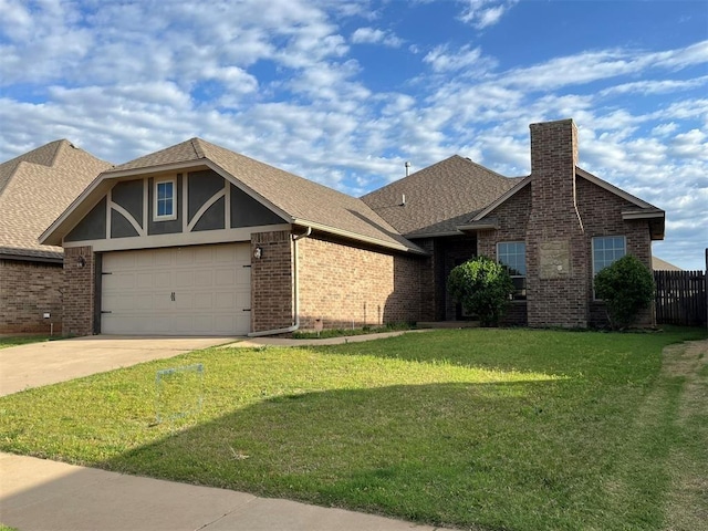 view of front of property featuring a garage and a front yard