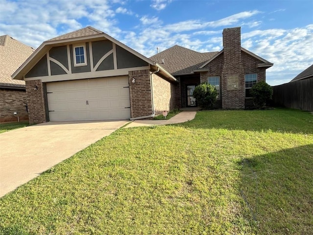 view of front of property with a garage and a front yard