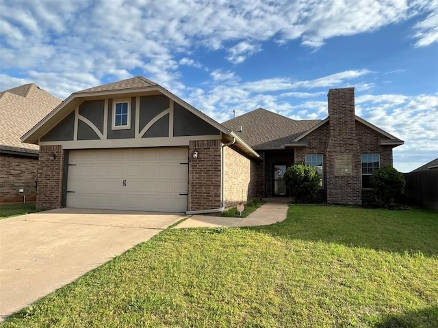 view of front of property featuring a front lawn and a garage