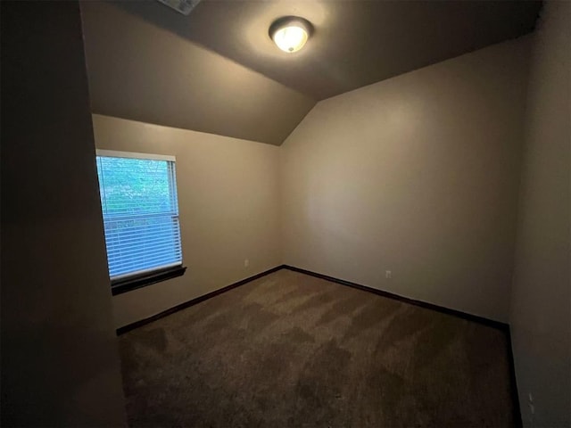 bonus room with carpet flooring and lofted ceiling