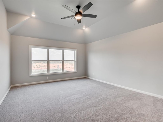 carpeted empty room featuring ceiling fan and lofted ceiling