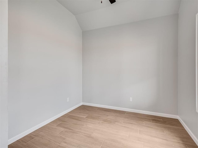 unfurnished room with ceiling fan and lofted ceiling