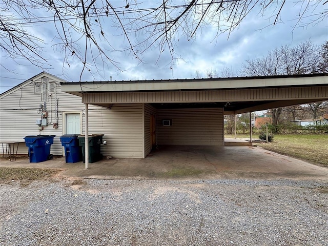 exterior space with a carport