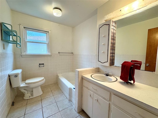 bathroom with tile patterned flooring, vanity, toilet, and tile walls