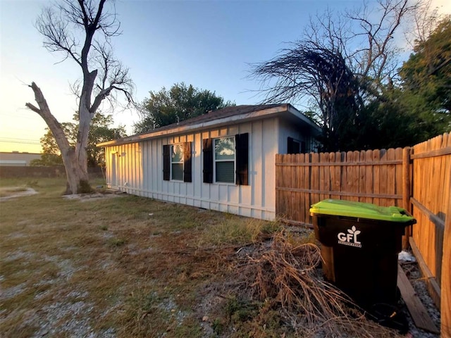 view of property exterior at dusk