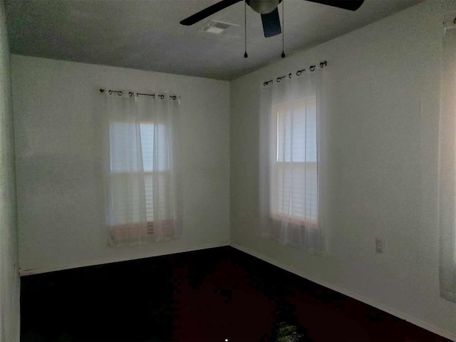 unfurnished room with ceiling fan