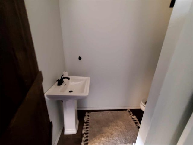 bathroom featuring sink and toilet