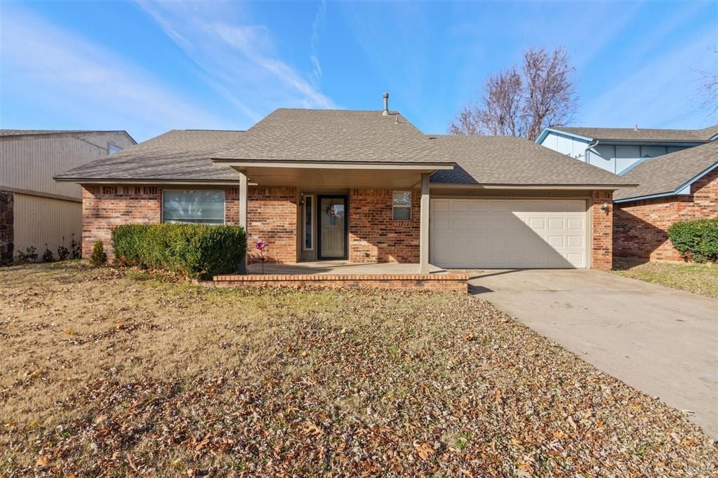 ranch-style house featuring a garage