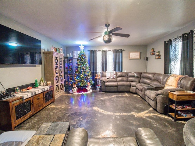 living room with ceiling fan and plenty of natural light