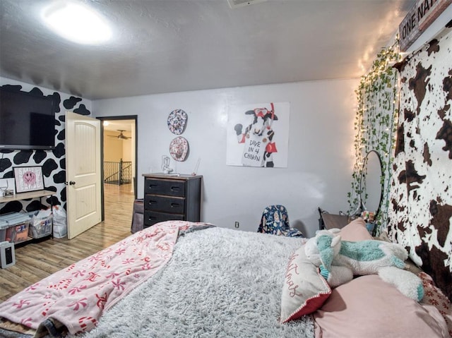 bedroom with hardwood / wood-style floors