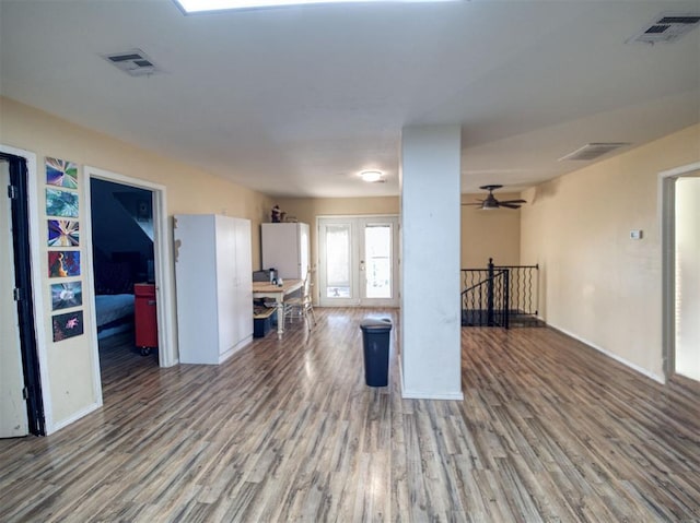 kitchen with ceiling fan, hardwood / wood-style floors, and french doors