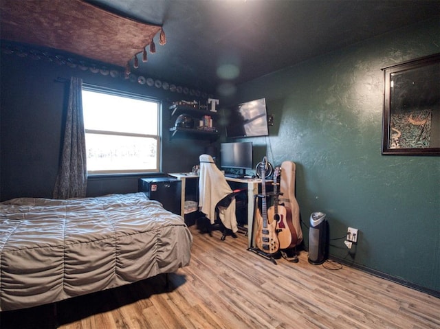 bedroom featuring hardwood / wood-style flooring