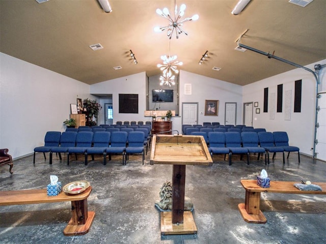 playroom featuring vaulted ceiling and an inviting chandelier