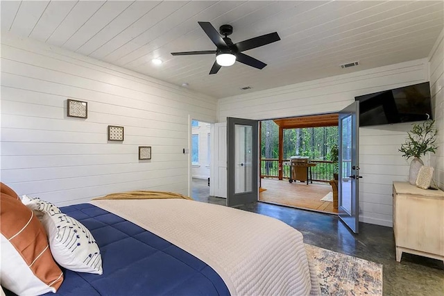 bedroom featuring french doors, wooden ceiling, ceiling fan, and wooden walls