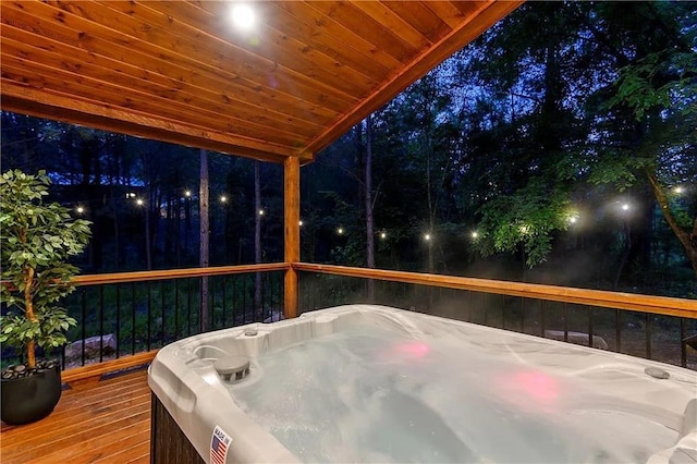 wooden terrace with a hot tub