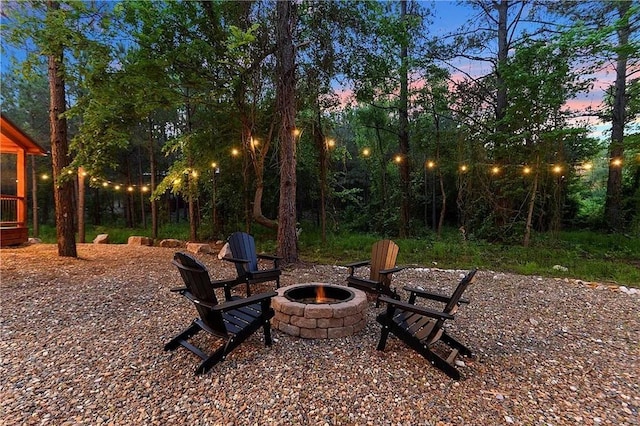 patio terrace at dusk with a fire pit