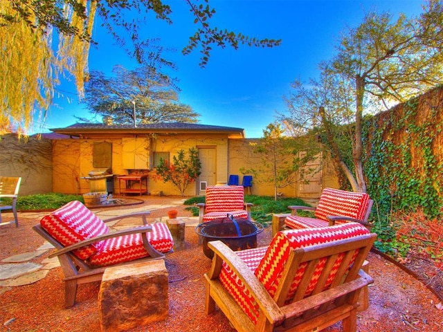 view of patio featuring a grill and an outdoor fire pit