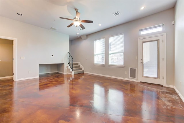 unfurnished living room with ceiling fan