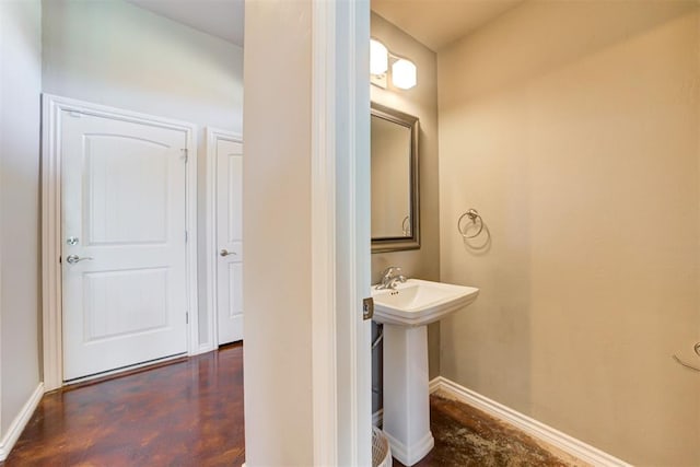 bathroom with sink and concrete floors