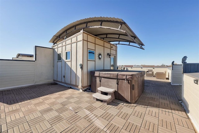 view of patio with a hot tub