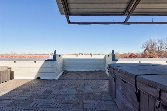 view of patio / terrace with a hot tub