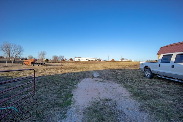 view of yard with a rural view