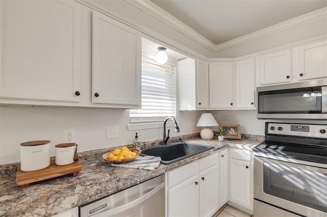 kitchen featuring sink, white cabinets, and stainless steel appliances