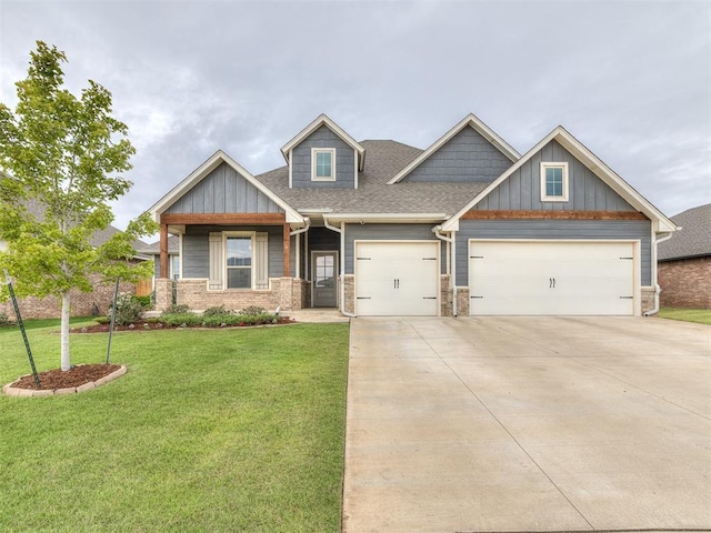 craftsman-style home featuring a garage, board and batten siding, concrete driveway, and a front lawn