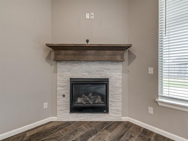 details with baseboards and wood finish floors