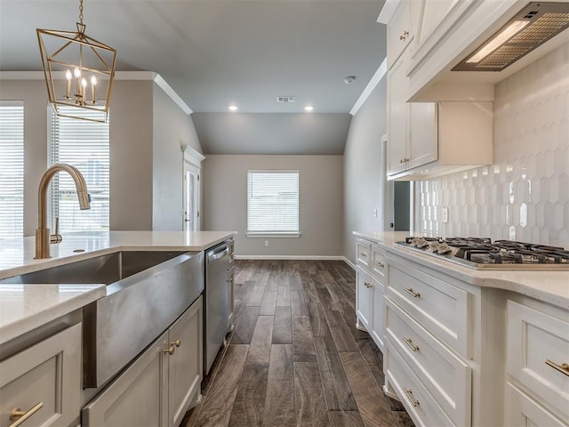 kitchen with premium range hood, dark wood finished floors, a chandelier, ornamental molding, and stainless steel appliances