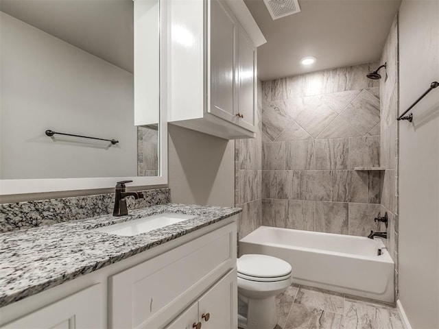 full bath featuring visible vents, toilet, vanity, and bathing tub / shower combination