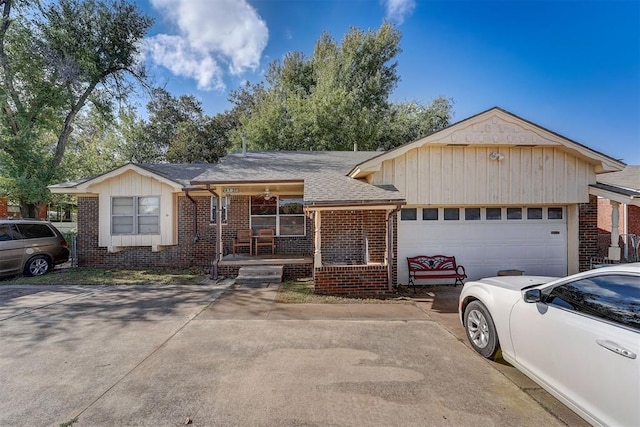 ranch-style home featuring a garage and covered porch