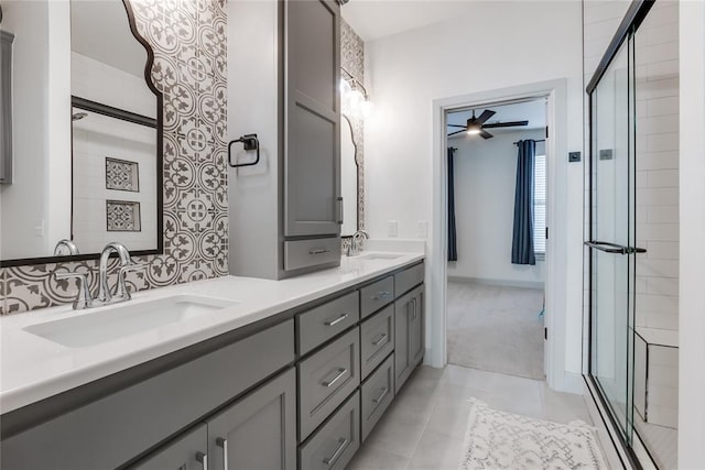 bathroom featuring ceiling fan, tile patterned flooring, vanity, and walk in shower