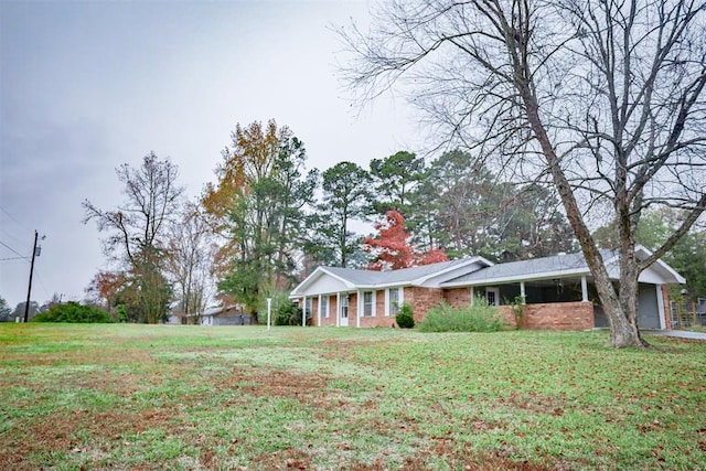 view of front facade with a garage and a front lawn