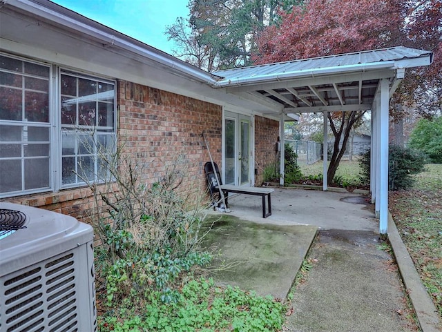 view of patio with french doors and central AC unit