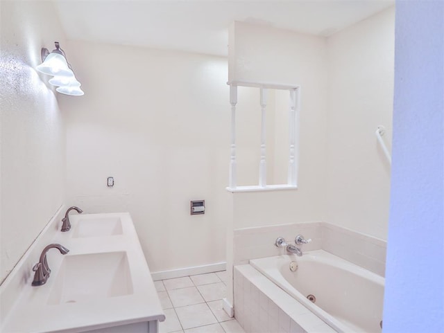 bathroom with tile patterned flooring, a relaxing tiled tub, and vanity