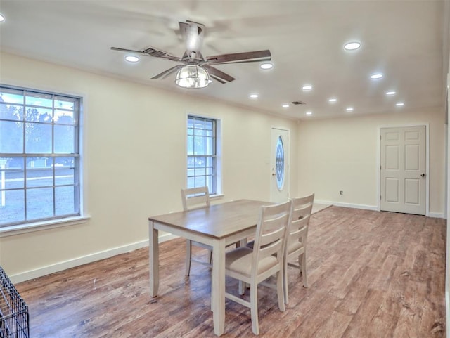 dining room featuring ceiling fan and light hardwood / wood-style flooring