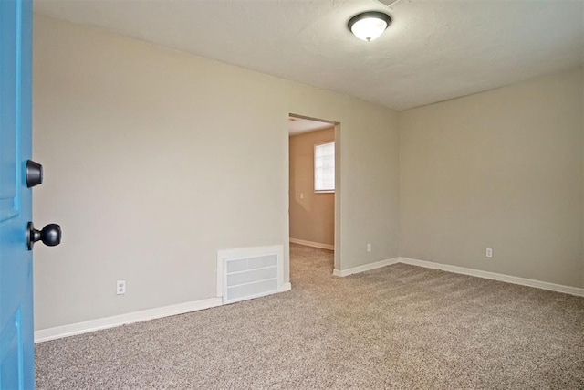 spare room featuring carpet