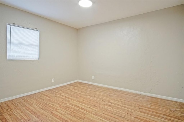 spare room featuring light hardwood / wood-style floors