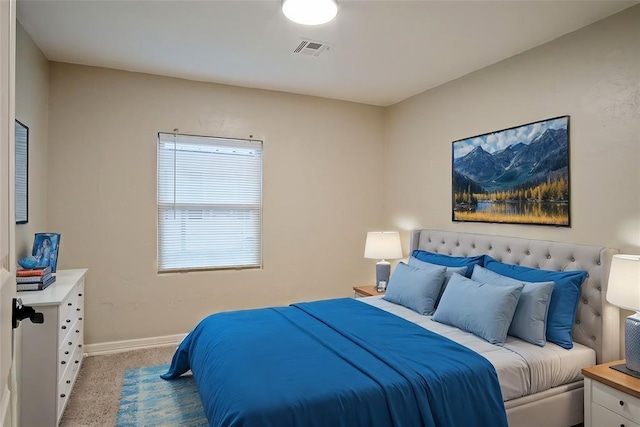 bedroom featuring light colored carpet