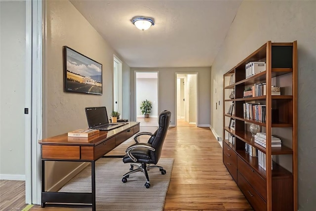 office space with light hardwood / wood-style flooring