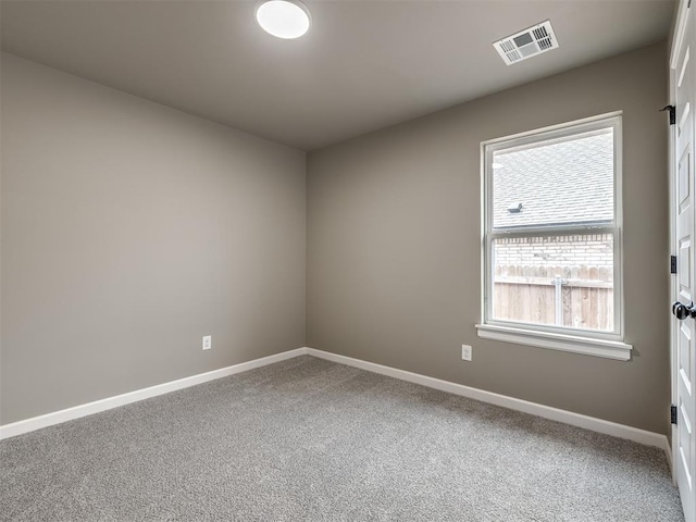 spare room with carpet flooring