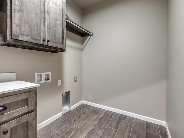 clothes washing area featuring washer hookup, cabinets, and hookup for an electric dryer