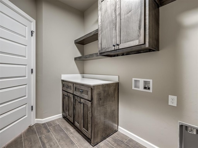 laundry area featuring hookup for a washing machine and cabinets