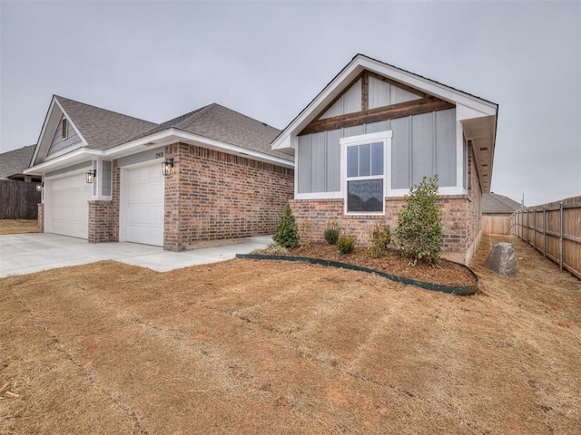 view of front of home with a garage and a front lawn