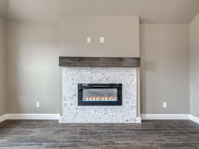 room details featuring a tile fireplace