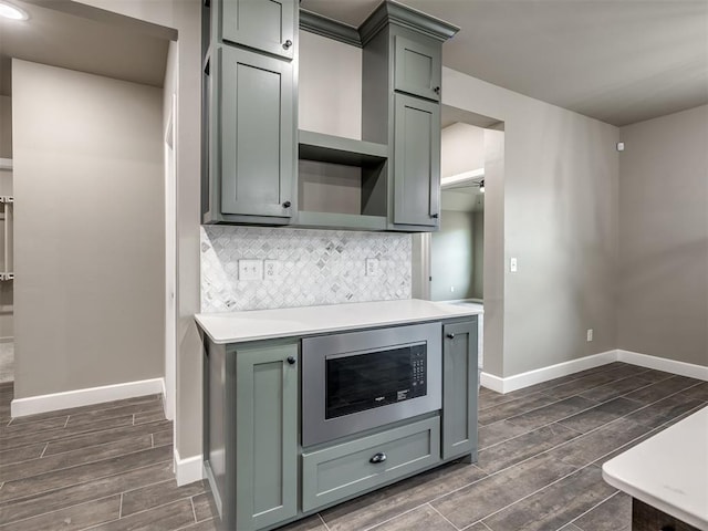 kitchen with built in microwave and backsplash