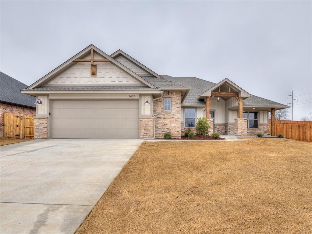 view of front of house with a garage and a front yard